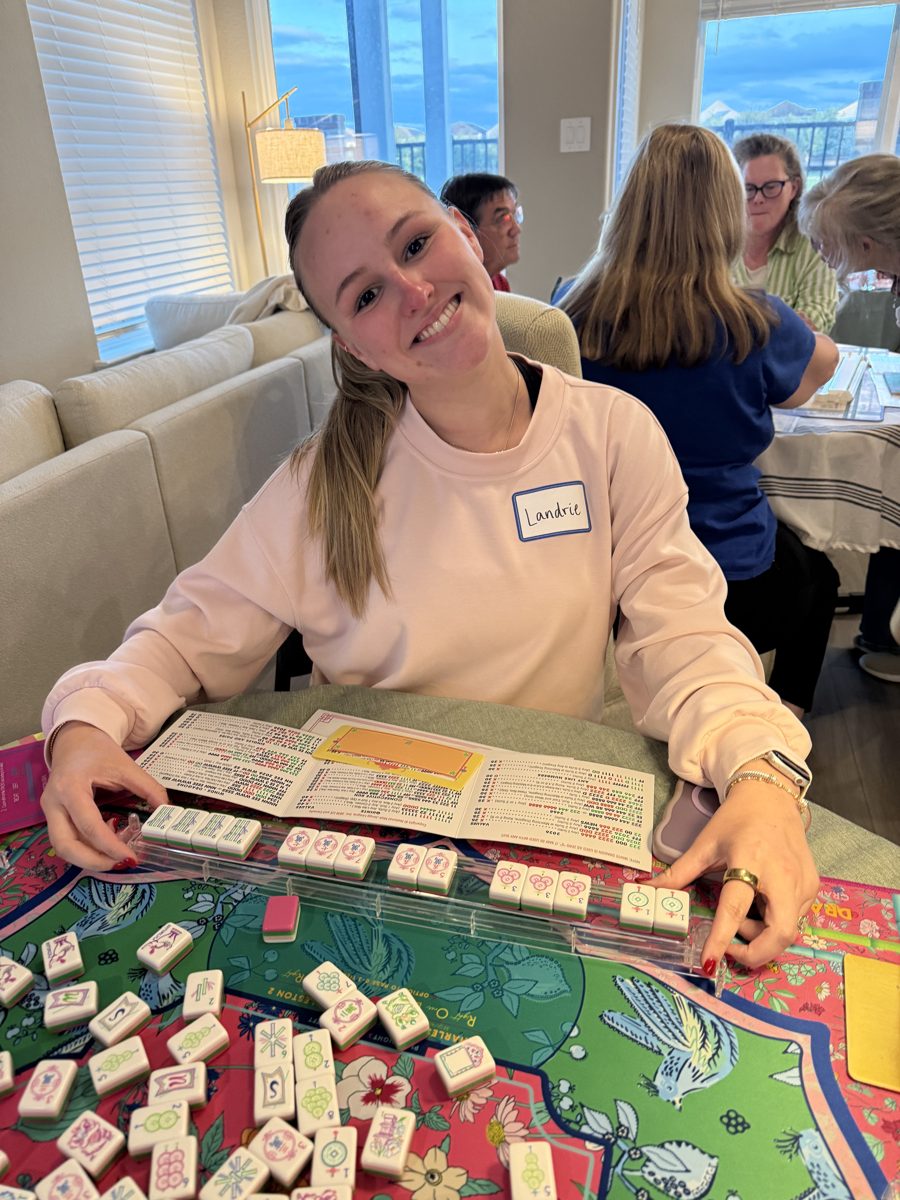 Landrie, June League co-winner, smiling behind her tiles